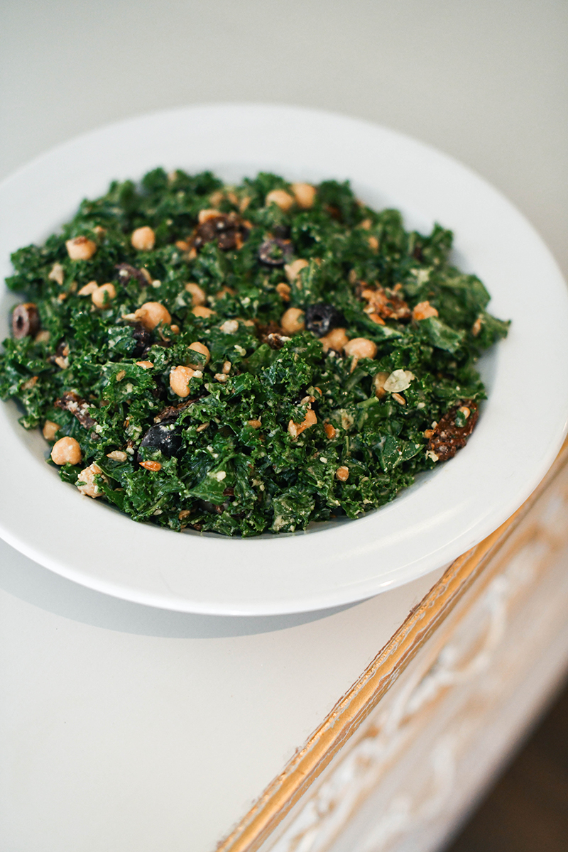 Greek Kale Salad, featuring chickpeas, olives, and a creamy tahini dressing!